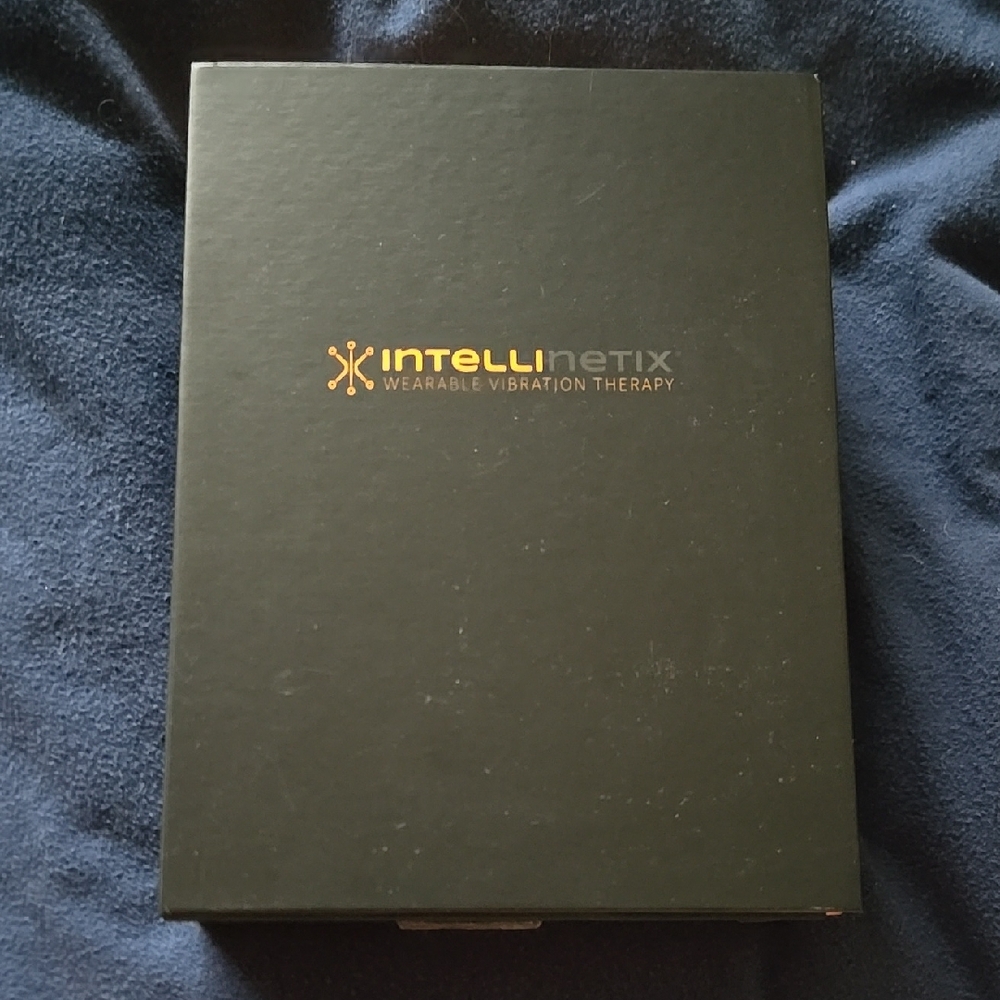 Black Wearable Vibration Therapy Device